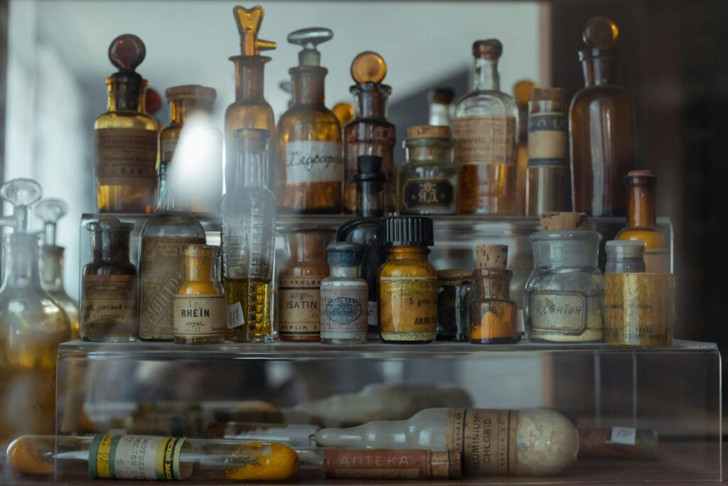 Collection of vintage apothecary bottles showcasing historical pharmaceutical storage.
